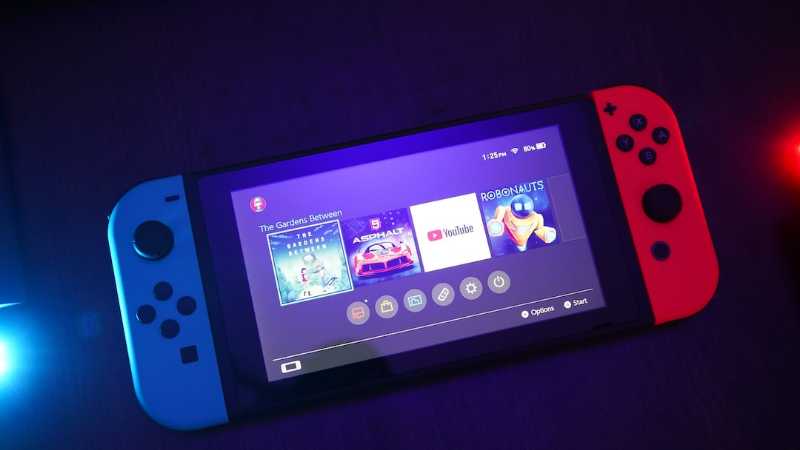 Nintendo Switch console turned on with Joy-Con controls - nintendo switch, my first ever console. biggest mistake i have done in 2020, totally not worth it. - unsplash