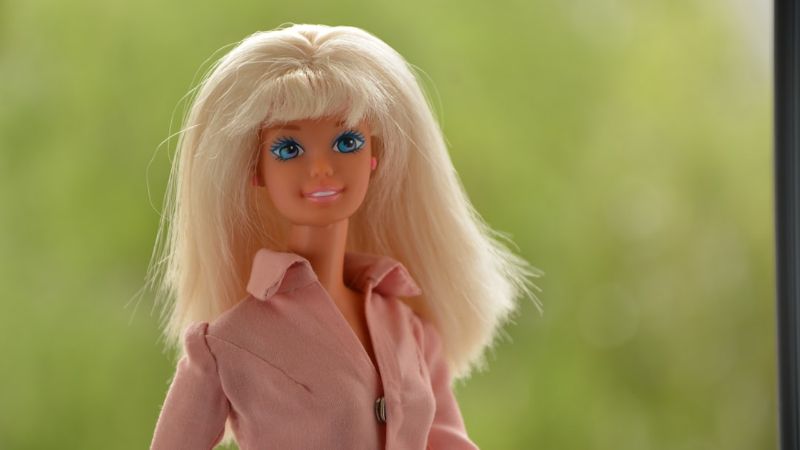 blonde haired doll in pink coat - Barbie 90th in a pink shirt , tags: mattel marketplace - unsplash