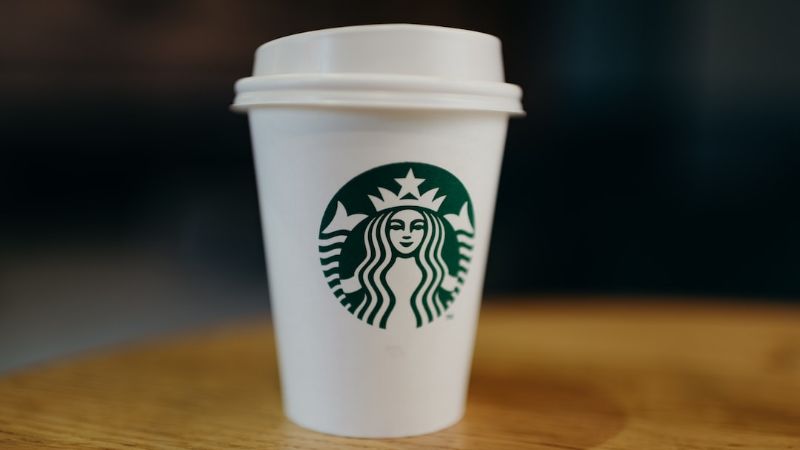 Starbucks disposable cup - Coffee cup, tags: odyssey web3 rewards - unsplash